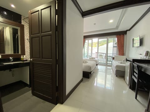 Family Triple Room, 1 Bedroom, Non Smoking, City View | Premium bedding, minibar, in-room safe, desk