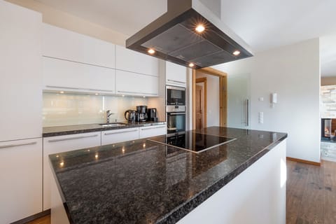 Four-Bedroom Apartment Type 4A | Private kitchen | Espresso maker, coffee/tea maker, highchair, dining tables