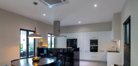 Elite Villa | Private kitchen | Fridge, coffee/tea maker, electric kettle, dining tables