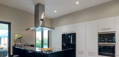 Elite Villa | Private kitchen | Fridge, coffee/tea maker, electric kettle, dining tables