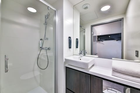 Shower, rainfall showerhead, towels, soap