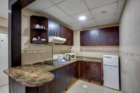 Family Apartment, 1 Bedroom | Private kitchen | Fridge, microwave, electric kettle, cookware/dishes/utensils