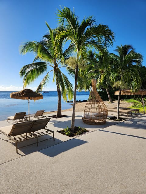 Private beach, white sand, sun loungers, beach umbrellas