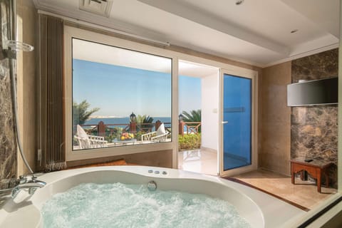 Premium Jacuzzi Room Sea View (Adults Only) | Egyptian cotton sheets, pillowtop beds, minibar, in-room safe