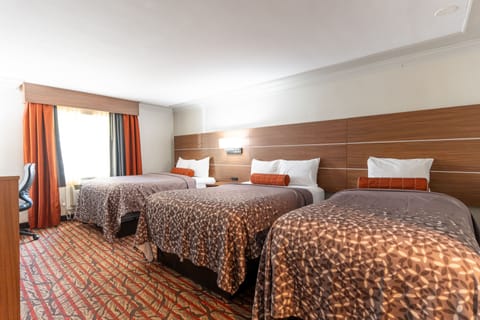 Deluxe Room, Multiple Beds | Desk, blackout drapes, soundproofing, iron/ironing board