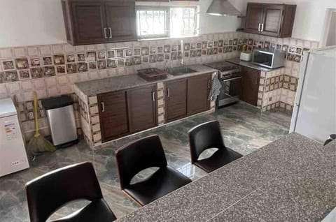 Villa | Private kitchen | Fridge, microwave, oven, stovetop