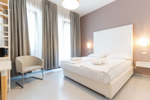 Classic Double Room, Balcony | Down comforters, in-room safe, desk, blackout drapes