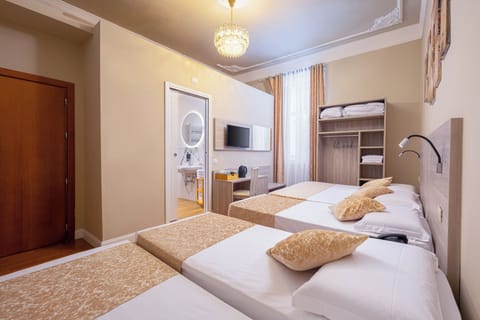 Family Room | Down comforters, minibar, in-room safe, desk