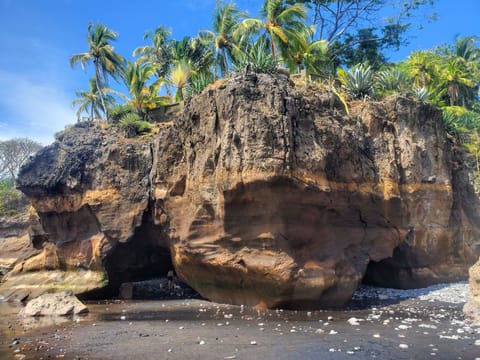 On the beach, black sand, beach massages