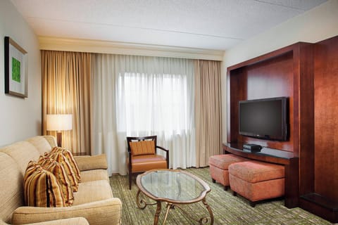 Suite, 1 Bedroom | Living area | 32-inch LCD TV with cable channels, TV, pay movies