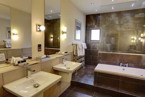 Suite, 1 Queen Bed, Non Smoking | Bathroom | Eco-friendly toiletries, hair dryer, towels