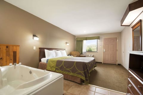 Suite, 1 King Bed, Hot Tub | Desk, iron/ironing board, free cribs/infant beds, rollaway beds