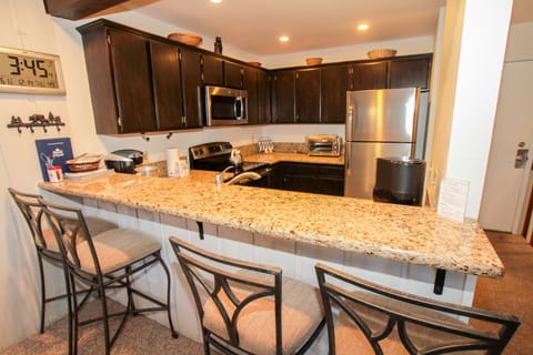 2-Bedroom Condo | Private kitchen | Full-size fridge, microwave, stovetop, dishwasher