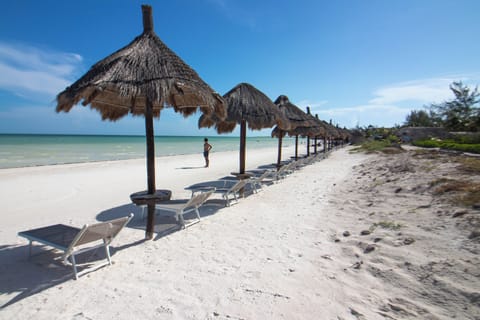 On the beach, sun loungers, beach towels