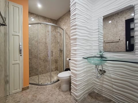 Premium Quadruple Room | Bathroom | Shower, rainfall showerhead, towels, soap