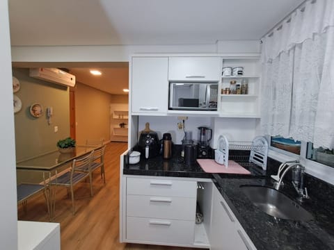 Honeymoon Apartment, Pool Access, Beach View | Private kitchen | Fridge, cookware/dishes/utensils, dining tables, kitchen islands