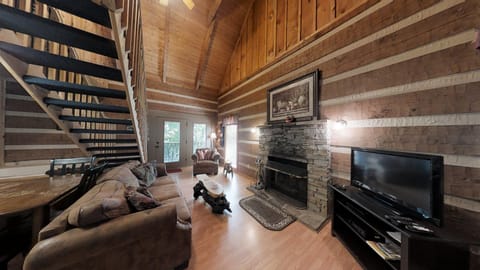 Cabin, 1 King Bed with Sofa bed, Hot Tub | Living area | 40-inch TV with cable channels, fireplace