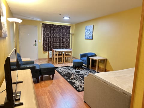 Family Suite, Non Smoking | Living area | 32-inch LED TV with cable channels, TV