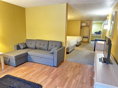 Family Suite, Non Smoking | Living area | 32-inch LED TV with cable channels, TV