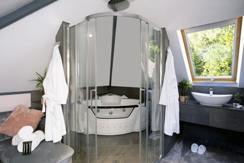 The Loft Suite | Bathroom | Designer toiletries, hair dryer, bathrobes, slippers