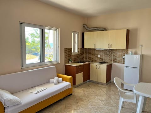 Family Apartment, 1 Bedroom, Kitchen, Oceanfront | Living area | 32-inch TV with cable channels