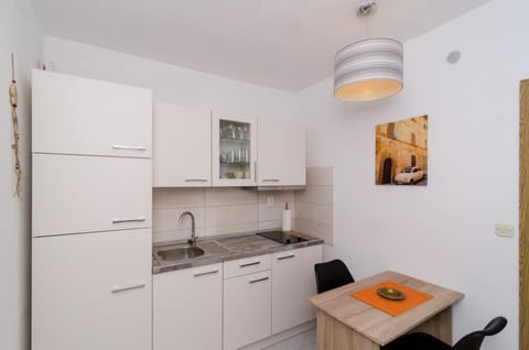 Apartment (One Bedroom Apartment with Shared Ter) | Private kitchen | Fridge