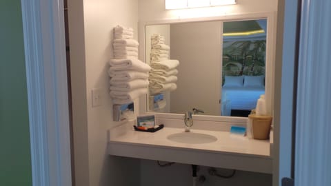 Deluxe Room, 2 Queen Beds, Kitchen | Bathroom | Combined shower/tub, hair dryer, towels