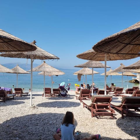 Private beach, white sand, sun loungers, beach umbrellas