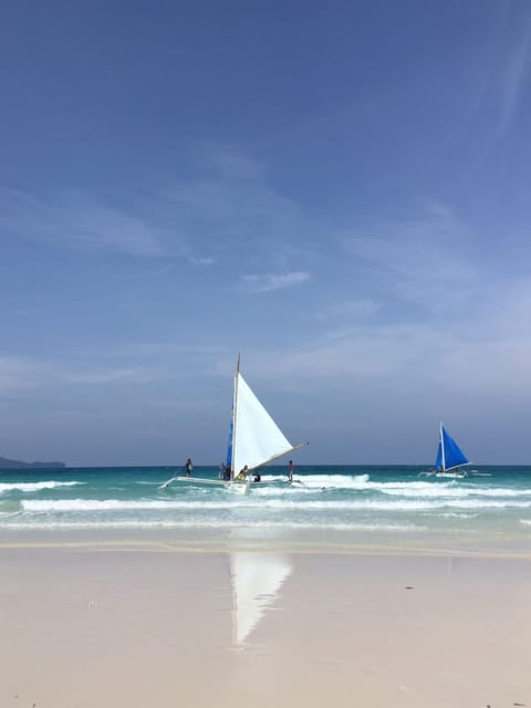 Beach nearby, white sand, beach towels