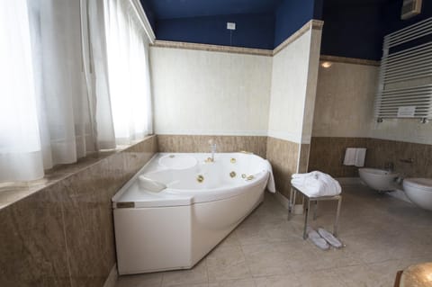 Suite | Bathroom | Shower, hair dryer, slippers, bidet