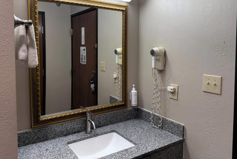 Desk, laptop workspace, blackout drapes, iron/ironing board