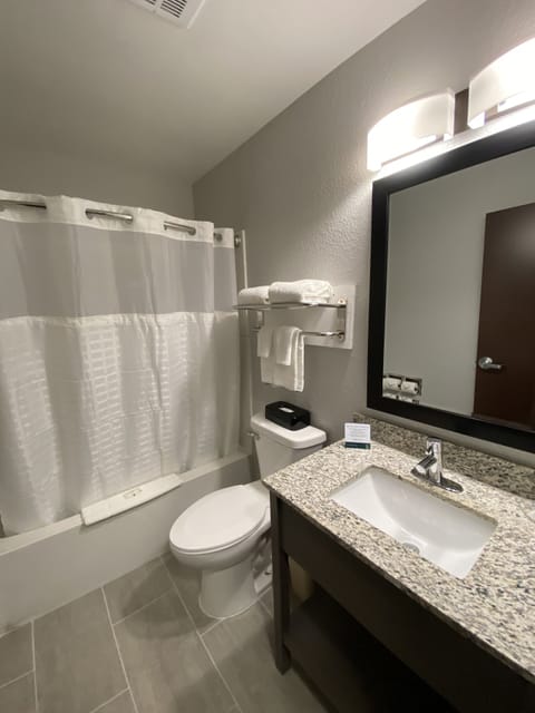 Combined shower/tub, hair dryer, towels, soap