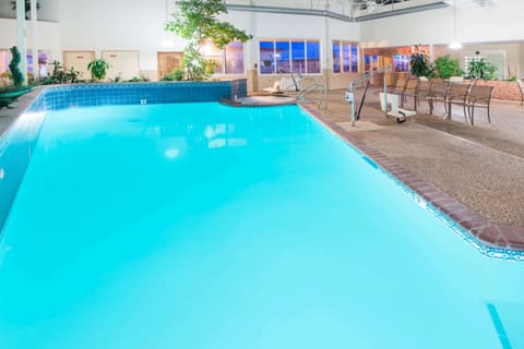 Indoor pool, open 7 AM to 11 PM, pool umbrellas, sun loungers