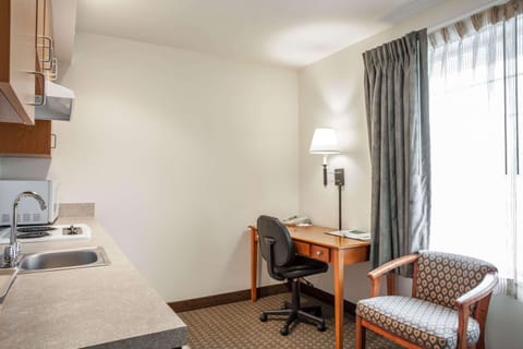 Deluxe Suite, 1 King Bed with Sofa bed, Non Smoking | Desk, laptop workspace, blackout drapes, iron/ironing board