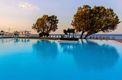 Indoor pool, outdoor pool, open 7:00 AM to 7:00 PM, sun loungers