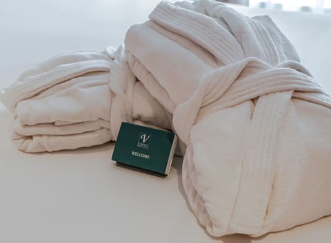 Premium bedding, down comforters, minibar, in-room safe