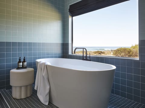 Premium Ocean View King Studio Suite | Bathroom | Shower, designer toiletries, hair dryer, towels