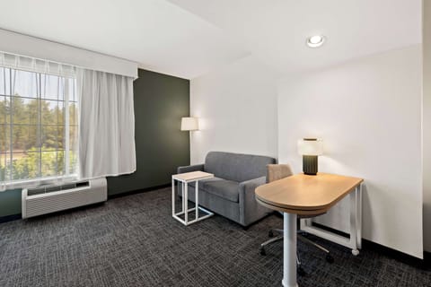 Room, 1 King Bed with Sofa bed | Living area | Flat-screen TV