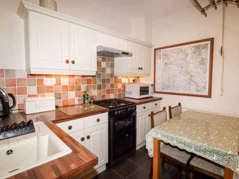 Fridge, electric kettle, toaster, cookware/dishes/utensils