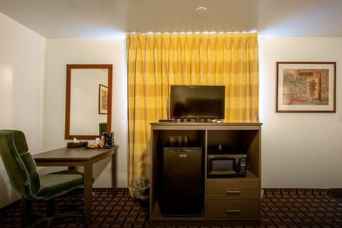 Room, 2 Queen Beds, Non Smoking, Refrigerator & Microwave | Living area | 32-inch flat-screen TV with cable channels, TV