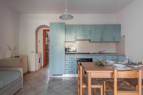 Standard Apartment, 1 Bedroom (Le Dimore di Budoni Bilo) | Private kitchenette | Microwave, stovetop, cookware/dishes/utensils