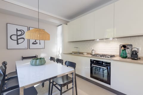 Family Apartment, 2 Bedrooms, 2 Bathrooms, Lakeside (Porto Letizia Viola 1) | Private kitchen | Fridge, stovetop, dishwasher, coffee/tea maker