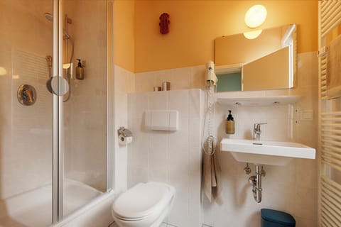 City Studio Suite | Bathroom | Shower, hair dryer, towels, soap