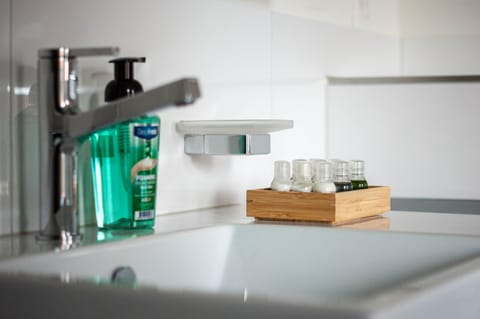 Shower, hair dryer, heated floors, towels