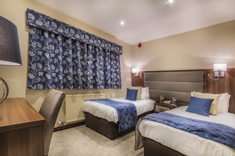 Classic Twin Room | Blackout drapes, iron/ironing board, free WiFi, bed sheets