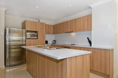 Three Bedroom Townhouse | Private kitchen | Fridge, microwave, oven, stovetop