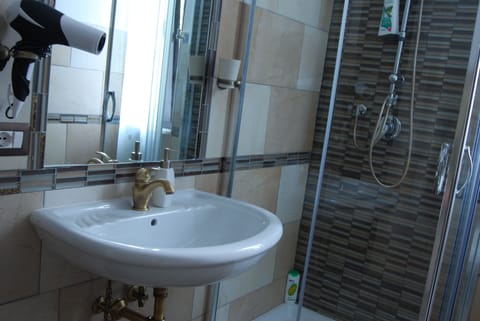 Shower, rainfall showerhead, designer toiletries, hair dryer