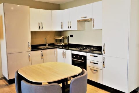 Apartment, Multiple Beds | Private kitchen | Fridge, stovetop