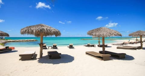 Private beach, white sand, sun loungers, beach umbrellas