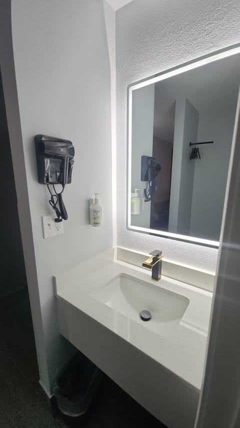 Hair dryer, towels, soap, shampoo